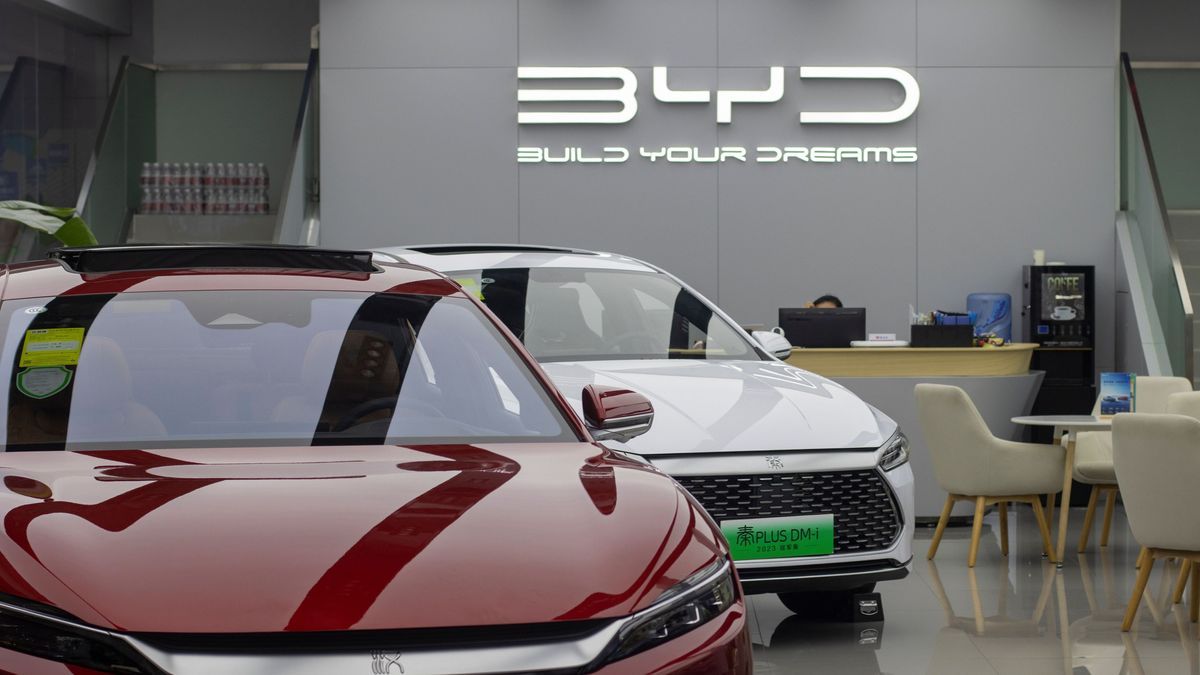 Beijing, China - July 17, 2023: BYD Qin Plus DM-i plug-in hybrid sedan and Han all-electric sedan are displayed in a BYD store in Beijing, China. BYD is China's largest new energy vehicle (NEV) maker.