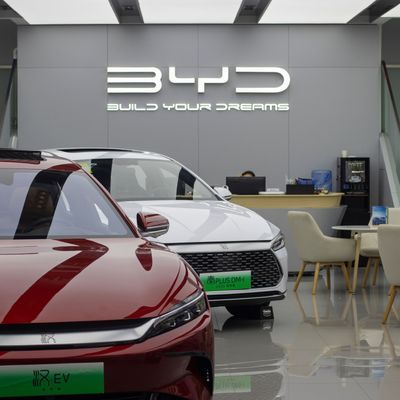 Beijing, China - July 17, 2023: BYD Qin Plus DM-i plug-in hybrid sedan and Han all-electric sedan are displayed in a BYD store in Beijing, China. BYD is China's largest new energy vehicle (NEV) maker.