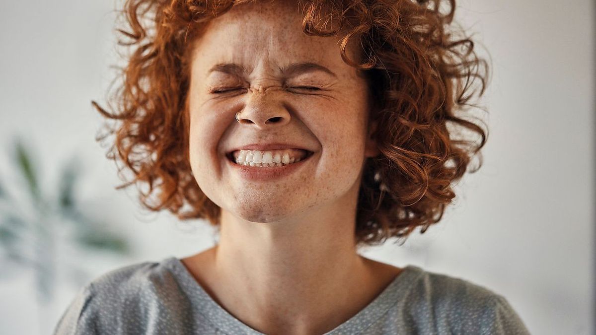 Portrait of a happy woman with closed eyes