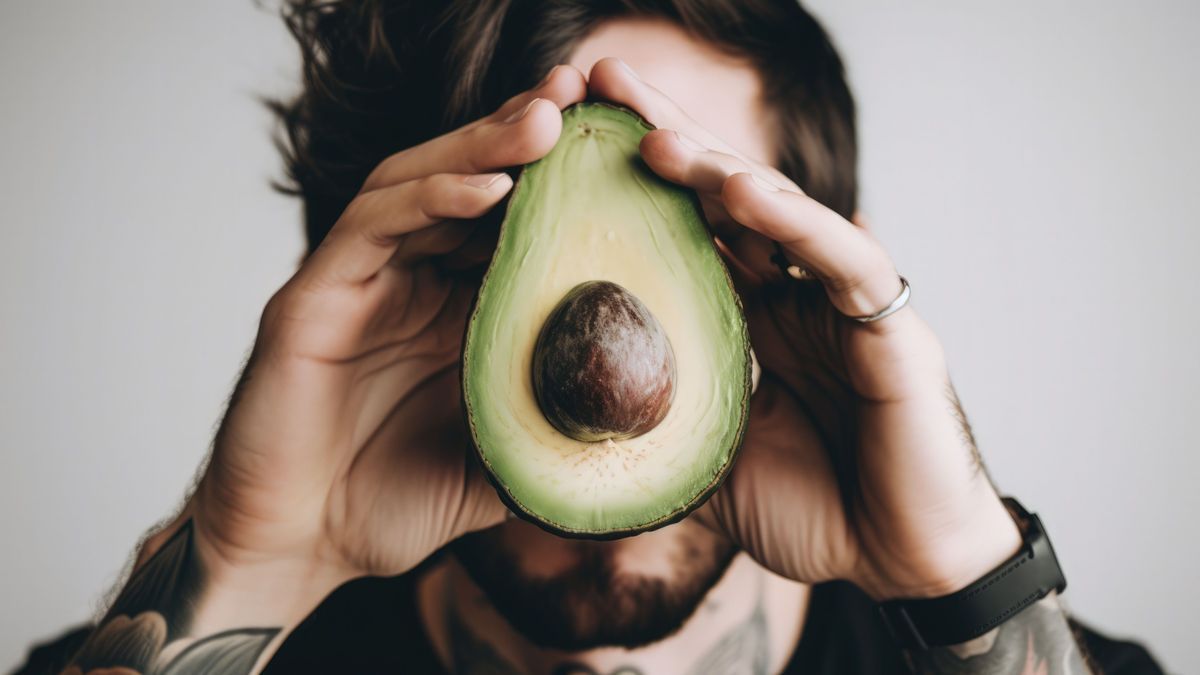 man holding a avocado in front of his face, generative ai