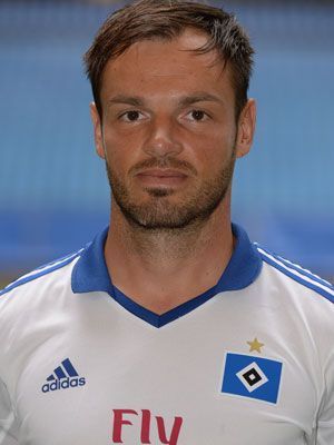 
                <strong>Hamburger SV Heimtrikot</strong><br>
                Der HSV spielt ab sofort in einem klassischen weißen Trikot mit blauen Streifen an den Ärmeln. Auch der Kragen ist in einem schönen dunkelblau gehalten. Natürlich werden die "Rothosen" auch in Zukunft ihrem Namen gerecht
              