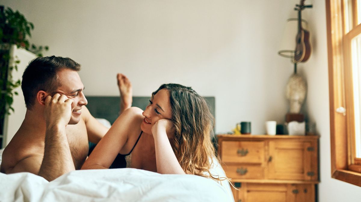 Love is the easiest way to have a sweet day. Shot of an affectionate young couple spending a romantic morning in bed at home.