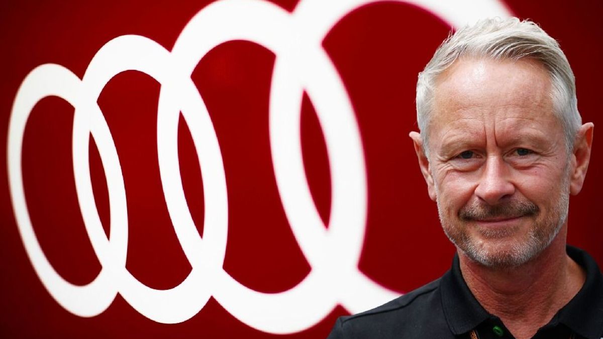 Fotomontage: Formel-1-Teamchef Jonathan Wheatley vor einem Audi-Logo