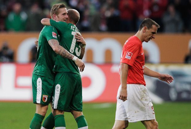 
                <strong>FC Augsburg - 1. FSV Mainz 05 2:1</strong><br>
                Des einen Freud, des anderen Leid - die Mainzer kommen in Augsburg durch einen Elfmeter nochmal auf ein Tor ran. Doch am Ende bleibt es beim 2:1 der Gastgeber. Andre Hahn (l.) ist mit seinen zwei Toren der Matchwinner
              