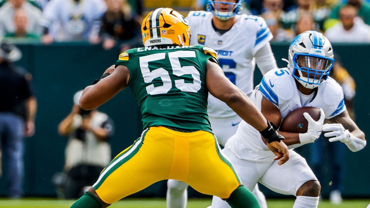Detroit Lions quarterback Jared Goff (C) watches Detroit Lions running back David Montgomery (R) run on Green Bay Packers defensive end Kingsley Enagbare (L) in the first half of the NFL, American ...