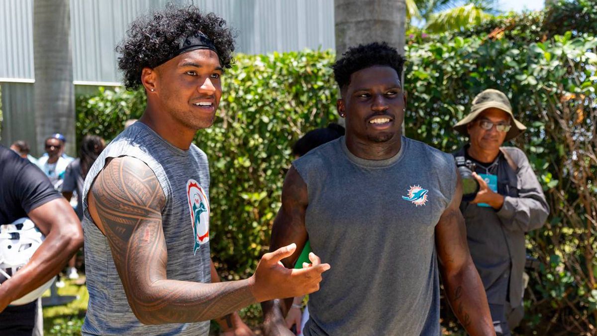 July 14, 2024: Miami Dolphins quarterback Tua Tagovailoa 1 interacts with teammate Tyreek Hill 10 during NFL, American Football Herren, USA mandatory minicamp at Baptist Health Training Complex in ...