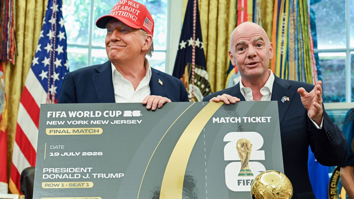President Donald Trump and FIFA President Gianni Infantino hold a ticket to the 2026 FIFA World Cup after after announcing the 2026 World Cup draw will be held at the Kennedy Center in December in ...
