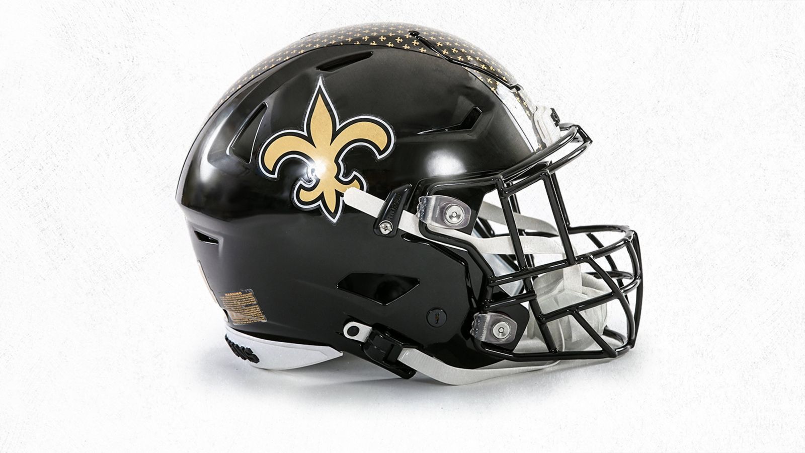 
                <strong>New Orleans Saints</strong><br>
                Die New Orleans Saints setzen bei ihrem Alternate Helmet seit 2022 ebenfalls auf Schwarz und verzichten nahezu komplett auf das Altgoldene. Anstelle des Streifens in der Mitte zieren kleine Lilien in eben jenem Altgold den ansonsten schwarzen Helm.
              