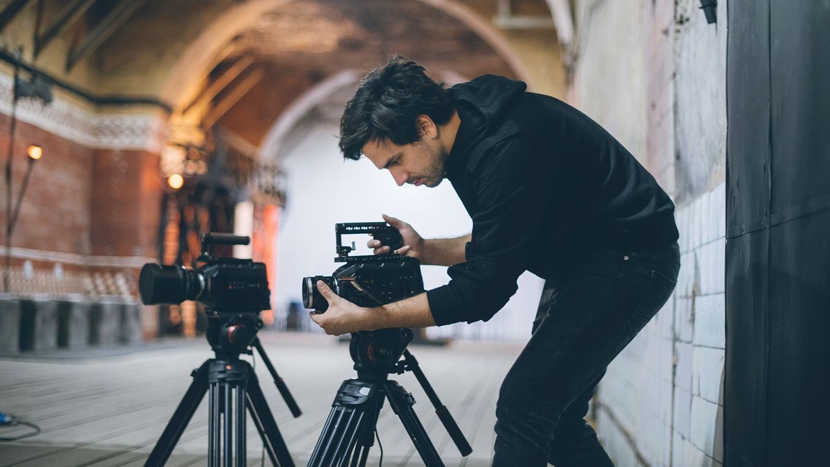 Director of photography with a camera in his hands on the set.