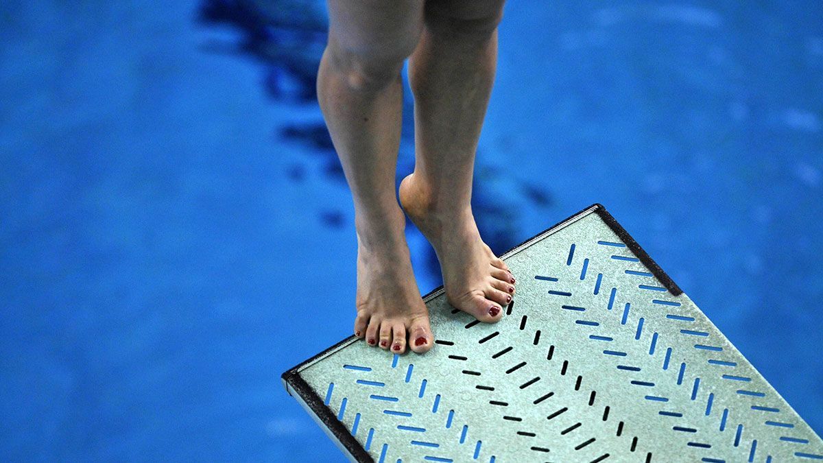 Nail fungus often develops through contact with infected surfaces, such as in swimming pools.