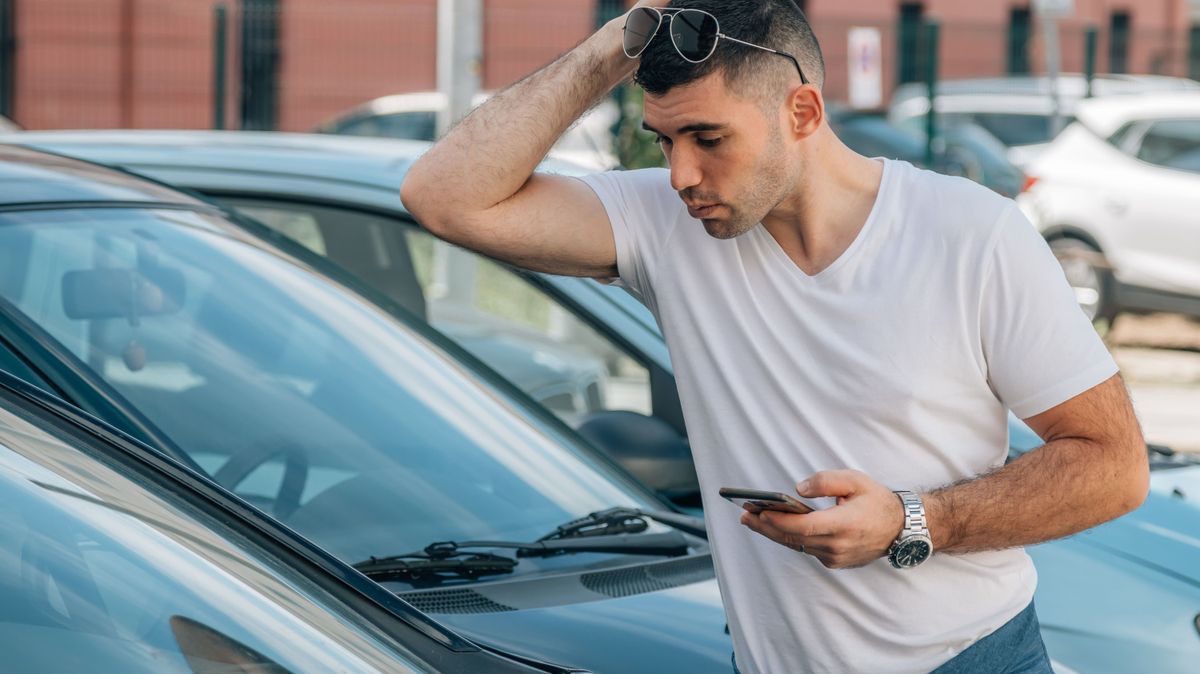 man looking and buying used car