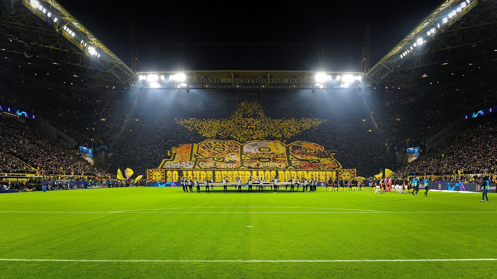 
                <strong>Borussia Dortmund: Gelbe Wand und Borusseum</strong><br>
                Der Signal-Iduna-Park ist mit einer Kapazität von über 81.000 Zuschauern nicht nur das größte Stadion Deutschlands, sondern war auch das erste reine Fußballstadion der Republik. Einen besonderen Heimbonus haben die Borussen auch wegen der größten Stehplatztribüne der Welt – der Gelben Wand. In das Stadion integriert ist auch das Borusseum, in dem Besucher die einzigartige Geschichte des Westfalenstadions nacherleben können.
              