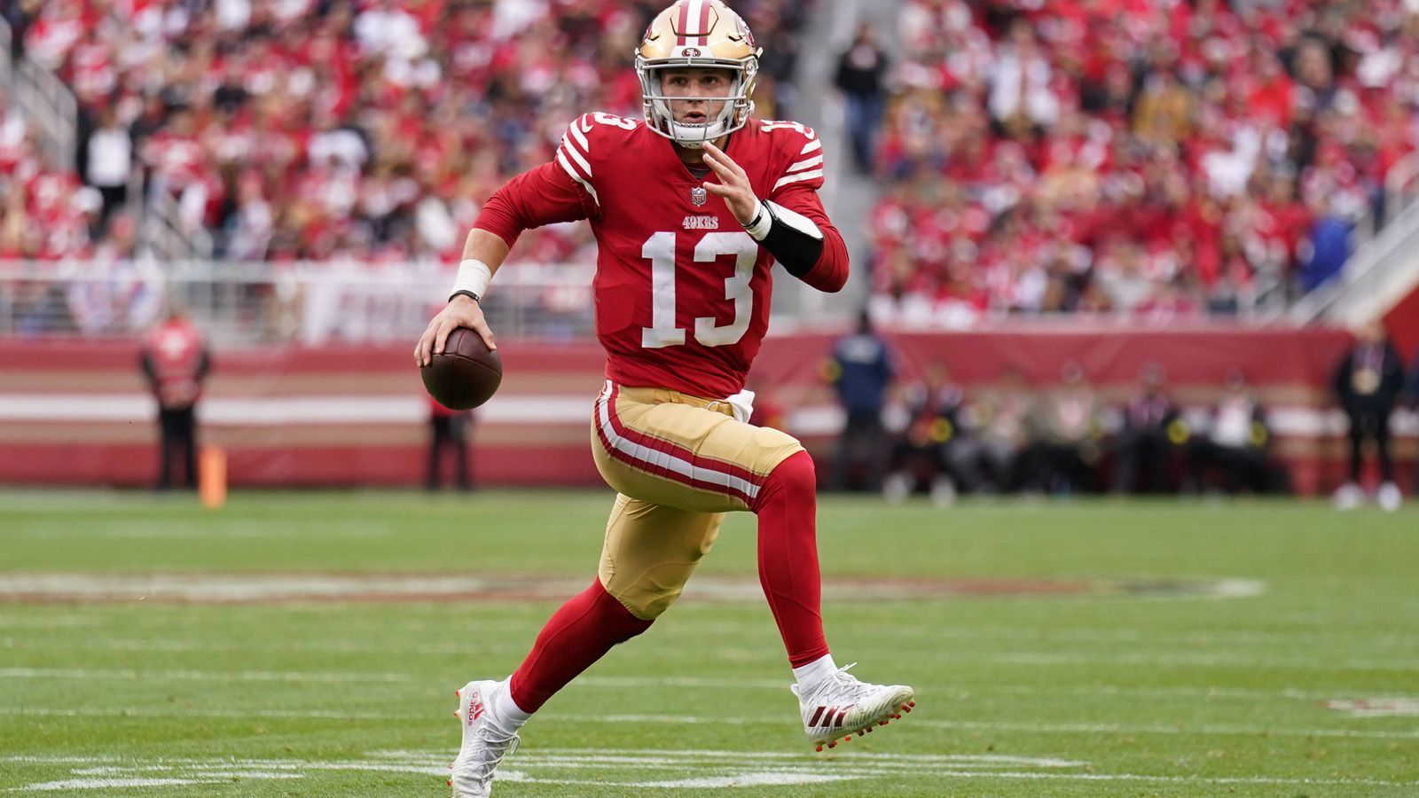 
                <strong>NFC West: San Francisco 49ers</strong><br>
                &#x2022; Head Coach: Kyle Shanahan <br>&#x2022; Quarterback: Brock Purdy (Foto)<br>&#x2022; Platzierung nach Regular Season: 1. der NFC West (Division), Platz 2 in der NFC (Conference)<br>&#x2022; Stadion: Levi's Stadium (Santa Clara, Kalifornien)<br>&#x2022; Gegründet: 1946<br>
              