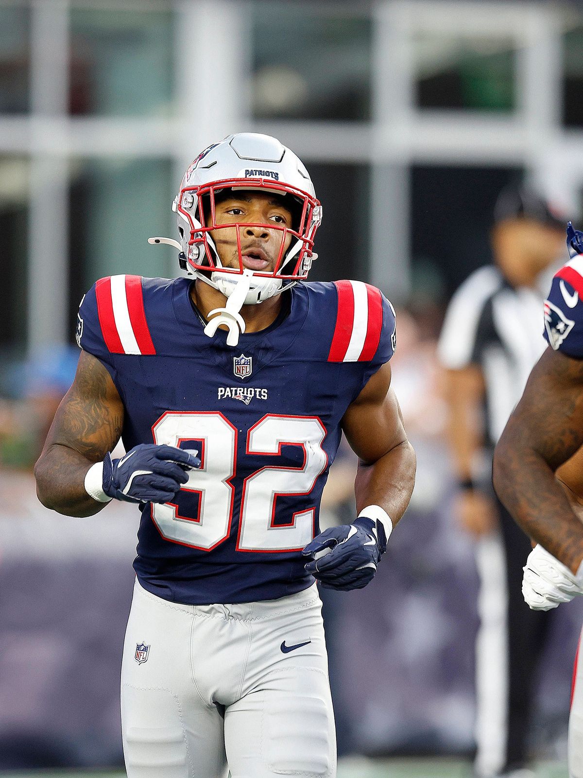 FOXBOROUGH, MA - AUGUST 08: New England Patriots running back TreVeyon Henderson (32) jogs to the bench after returning a punt for a touchdown during the NFL, American Football Herren, USA preseaso...