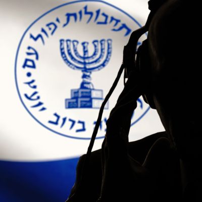 Secret agent of the Israeli intelligence eavesdropping on conversations, spy and special agent, the Israeli flag of the special services. Hebrew inscription, image of the menorah.