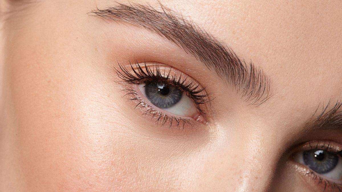  young girl open eyes with natural makeup close up