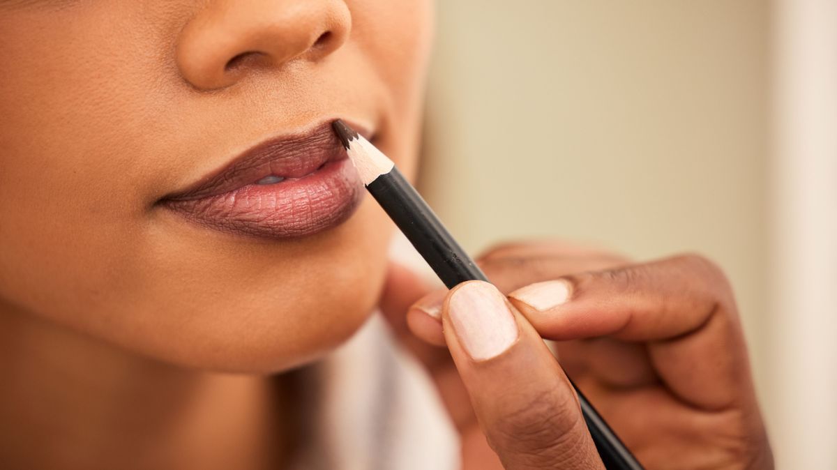 All a girl needs is a good lipliner. Cropped shot a woman applying lipliner.