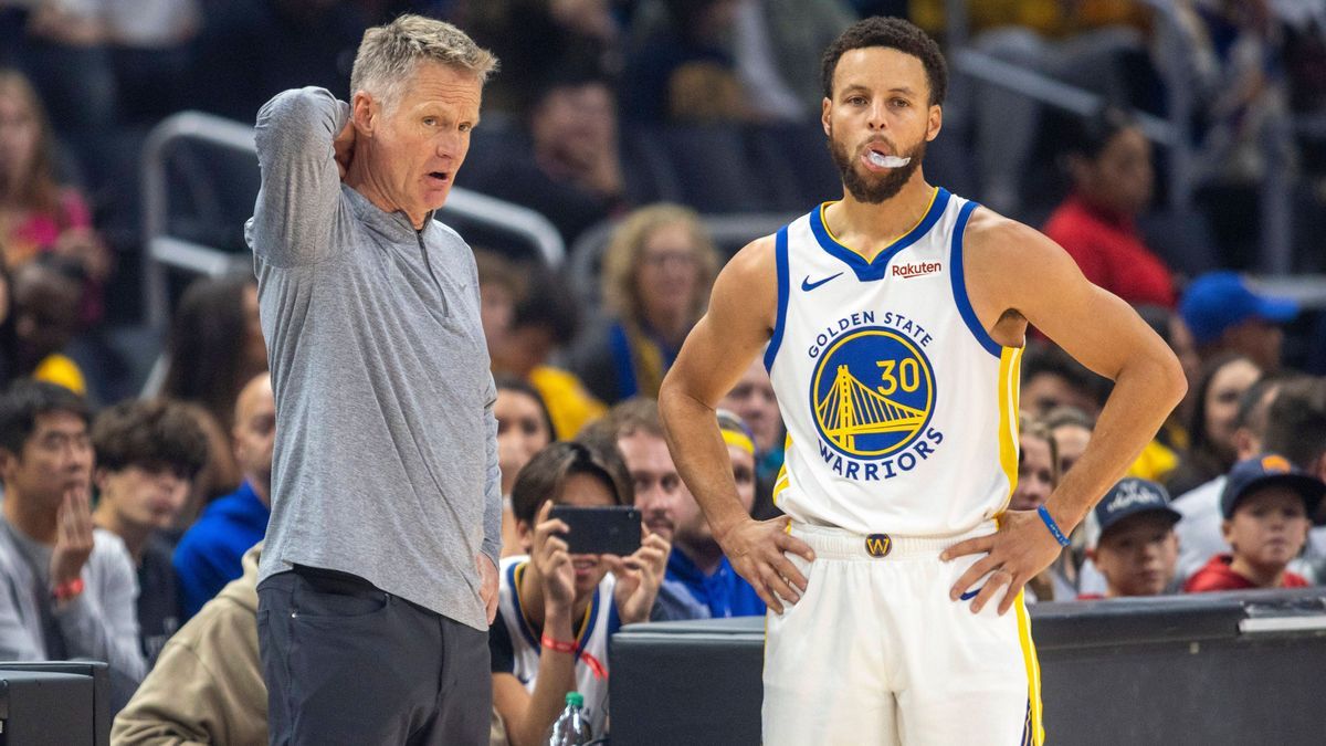 LOS ANGELES, CA - DECEMBER 02: Golden State Warriors head coach Steve Kerr talks with Golden State Warriors guard Stephen Curry (30) courtside during a break in the first half of an NBA, Basketball...