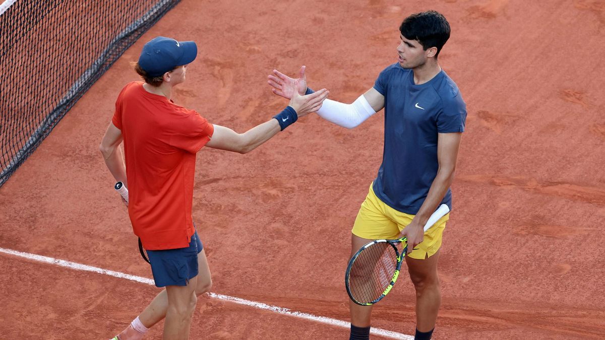 Carlos Alcaraz of Spain (R) shakes hands with Jannik Sinner of Italy at the end of their semi-final match at the French Tennis Open in Roland Garros in Paris, France, on Friday, June 7, 2024. Alcar...