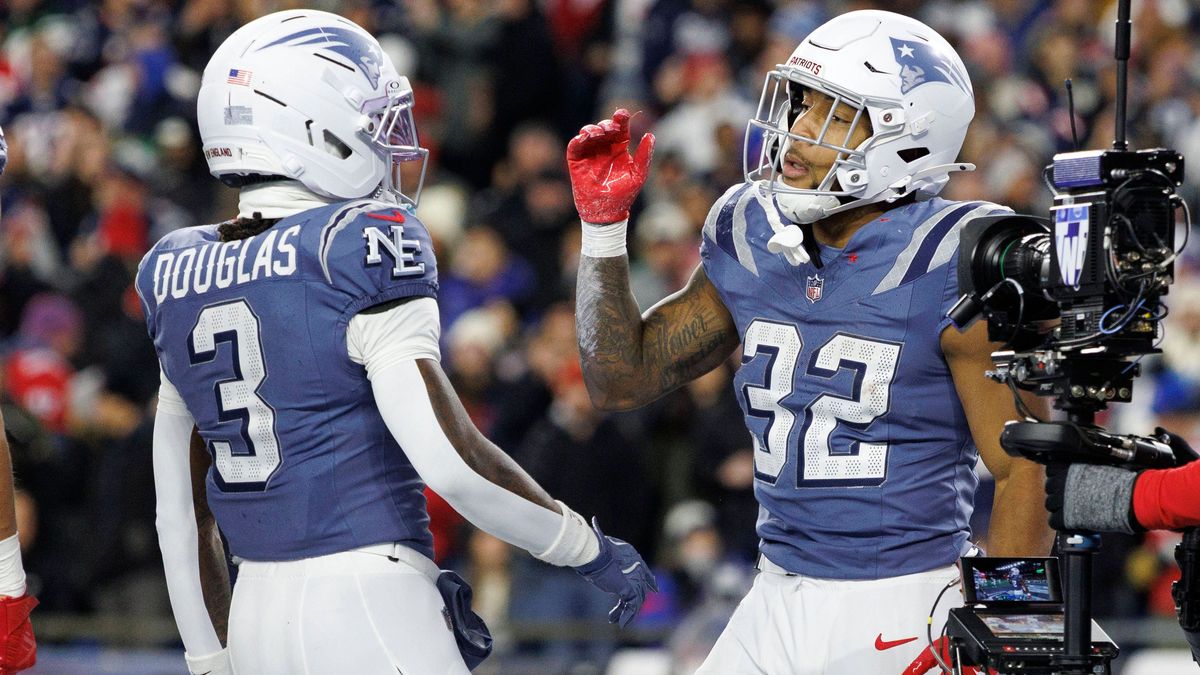 New England Patriots running back TreVeyon Henderson, right, celebrates his touchdown with New England Patriots wide receiver DeMario Douglas, left, during the first half against the New York Jets ...