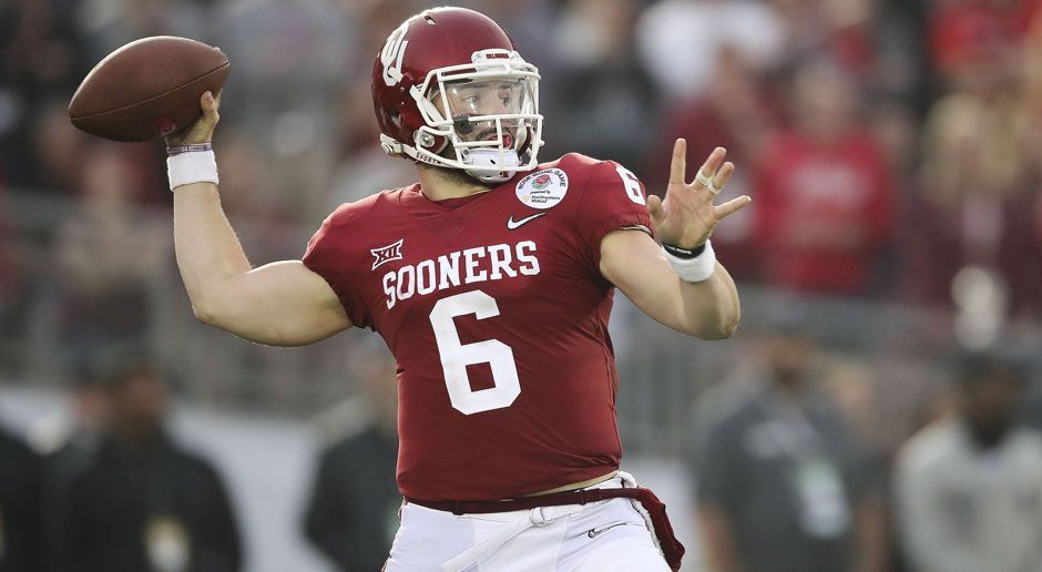 
                <strong>6. Pick - Arizona Cardinals: QB Baker Mayfield</strong><br>
                Die Indianapolis Colts haben ein Roster voller Löcher und es gibt noch ein Team, das kurzfristig einen Quarterback gebrauchen könnte. So sind es nun die Arizona Cardinals, die ihre Chance ergreifen und eine dringende Absicherung für die Knie Sam Bradfords brauchen. Baker Mayfield ist der statistisch gesehen beste Quarterback der vergangenen College-Football-Saison und völlig verdienter Gewinner der Heisman-Trophy. Er würde mit den Arizona Cardinals eine Franchise an die Seite gestellt bekommen, in derer ruhigen Umgebung er zum Starter reifen könnte. Spieler wie Larry Fitzgerald und David Johnson können dabei als Mentoren dienen. Die Situation scheint idealer als bei einigen anderen möglichen Zielorten.
              