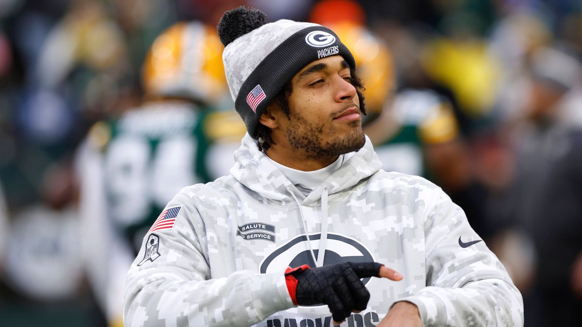 GREEN BAY, WI - NOVEMBER 24: Green Bay Packers cornerback Jaire Alexander (23) interacts with a fan during warmups of a game between the Green Bay Packers and the San Francisco 49ers at Lambeau Fie...