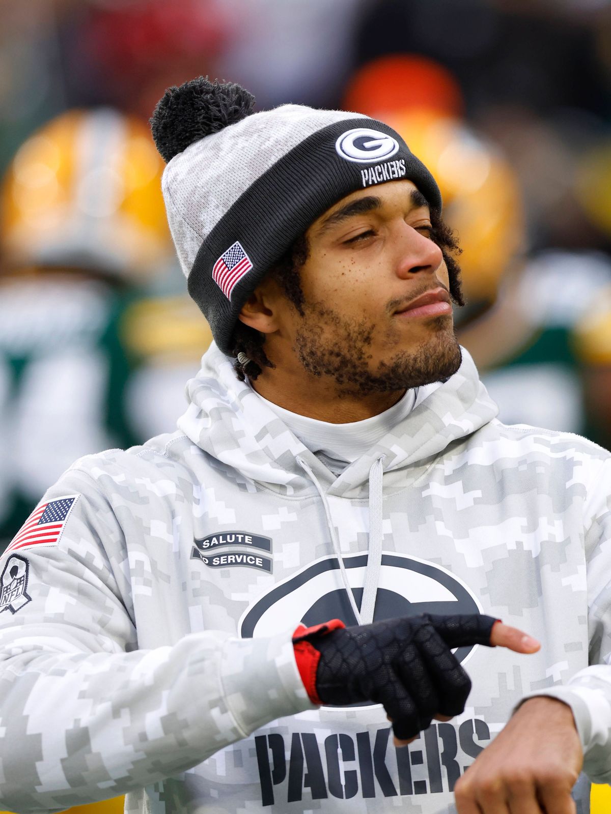 GREEN BAY, WI - NOVEMBER 24: Green Bay Packers cornerback Jaire Alexander (23) interacts with a fan during warmups of a game between the Green Bay Packers and the San Francisco 49ers at Lambeau Fie...