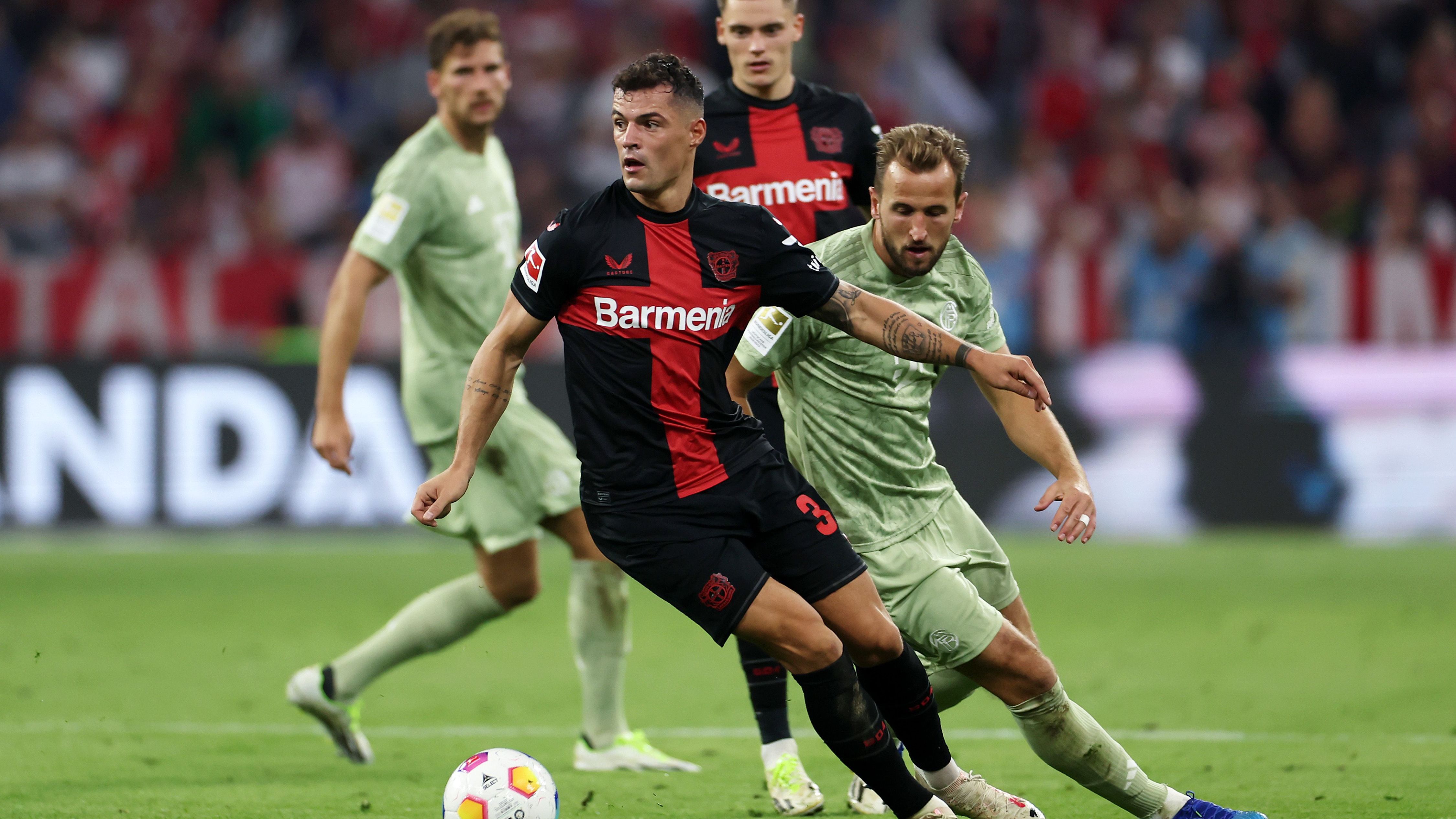 <strong>Granit Xhaka</strong><br>Leverkusens Star-Neuzugang ist in der durch Bayern dominant geführten Anfangsphase vor allem defensiv gefordert, wo er viele Löcher zulaufen muss und auch im Strafraum immer wieder entscheidend klärt. Mit Fortdauer der Partie schaltet sich Xhaka dann auch immer öfter mal offensiv mit ein, etwa bei einem Distanzschuss nach gut einer halben Stunde, mit dem er Ulreich prüft. <strong><em>ran</em>-Note: 3</strong>