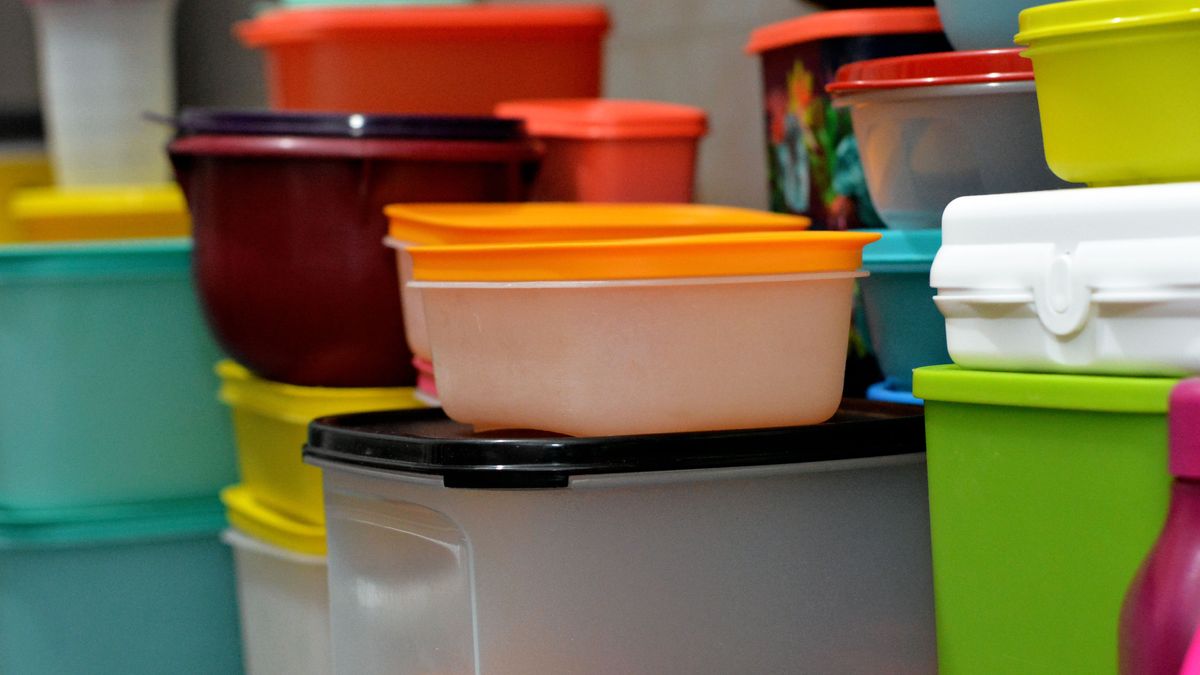 Cairo, Egypt, February 4 2021: pile of several and many Tupperware plastic products, Tupperware Corporation, an American multinational company produces plastic food storage containers and bottles