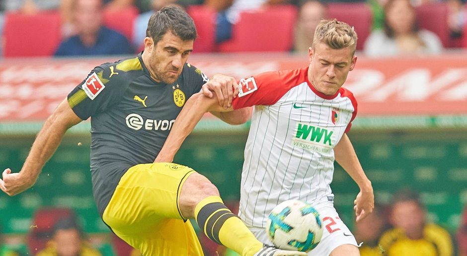 
                <strong>Sokratis</strong><br>
                Verliert gleich in der ersten Minute ein Kopfballduell gegen Finnbogason im Fünfmeterraum und hat Glück, dass das ohne Folgen bleibt. Im Anschluss ist Sokratis gewohnt aufmerksam und leistet sich kaum Fehler. Mit einer stoischen Ruhe klärt der Grieche, wenn es denn nötig ist, in der Luft und am Boden. Vor allem, als die Augsburger in Halbzeit zwei mehr Druck entfalten, ein umsichtiger Abwehrchef. ran-Note: 3
              