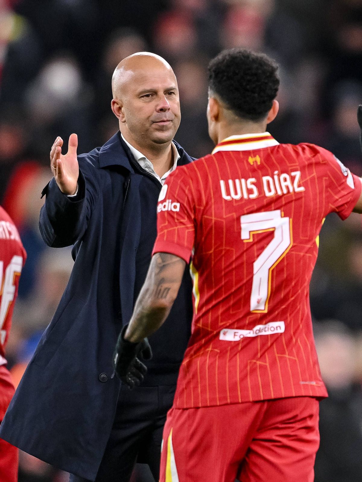 Trainer Arne Slot (Liverpool FC) und Luis Diaz (Liverpool FC) high-five each other during the UEFA Champions League 2024 25 League Phase MD5 match between Liverpool FC and Real Madrid C.F. at Anfie...