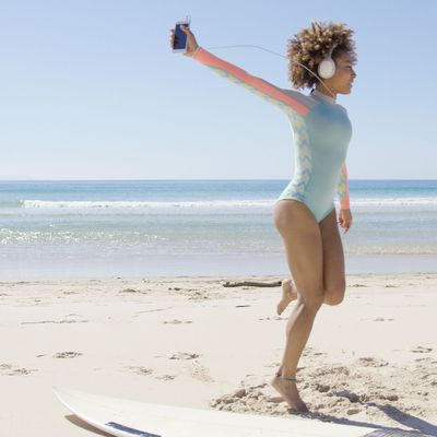 Female listening to music on beach