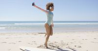 Female listening to music on beach