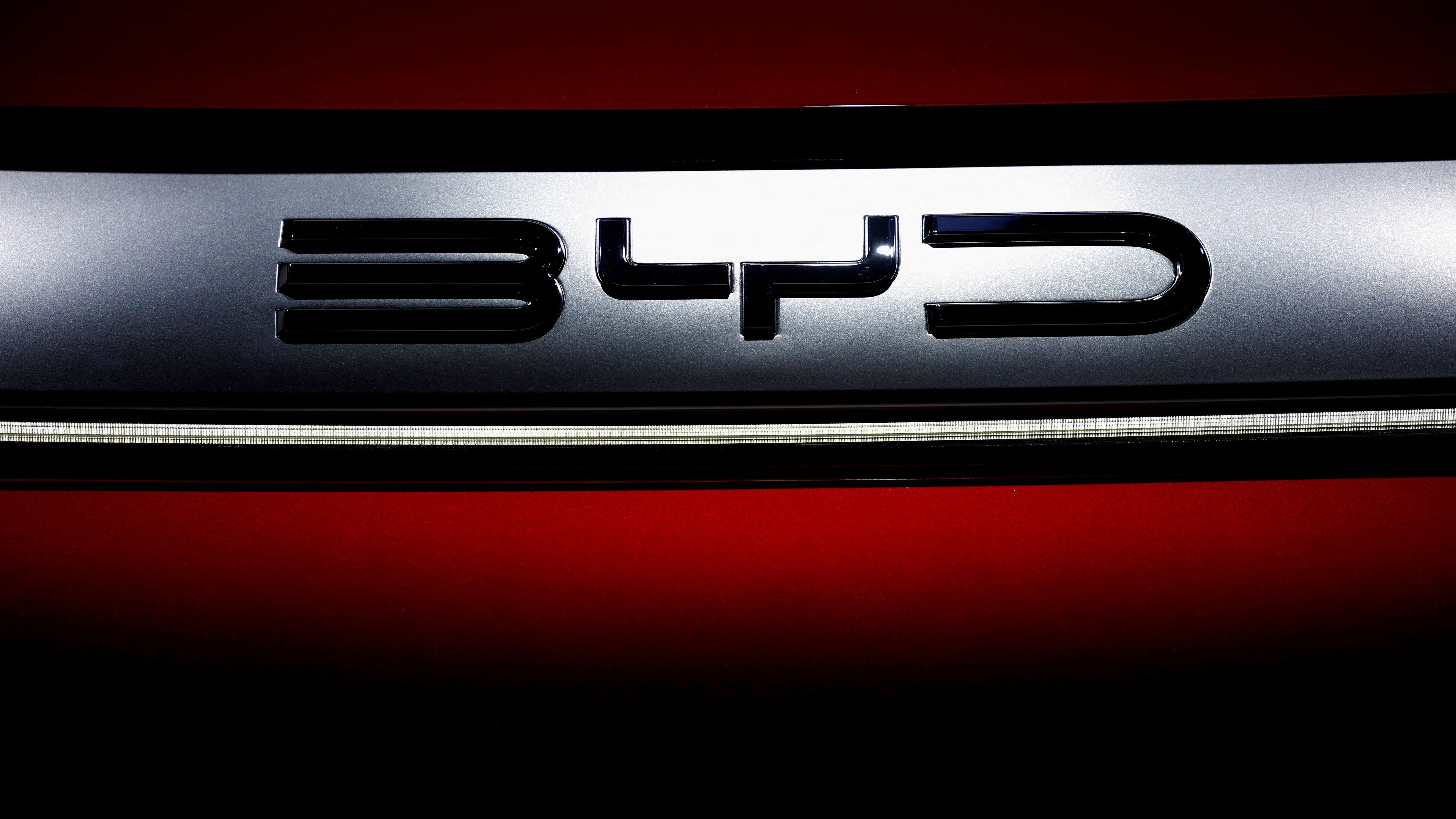 FILE PHOTO: The logo of BYD is pictured at the 2022 Paris Auto Show in Paris, France October 17, 2022. REUTERS/Stephane Mahe/File Photo