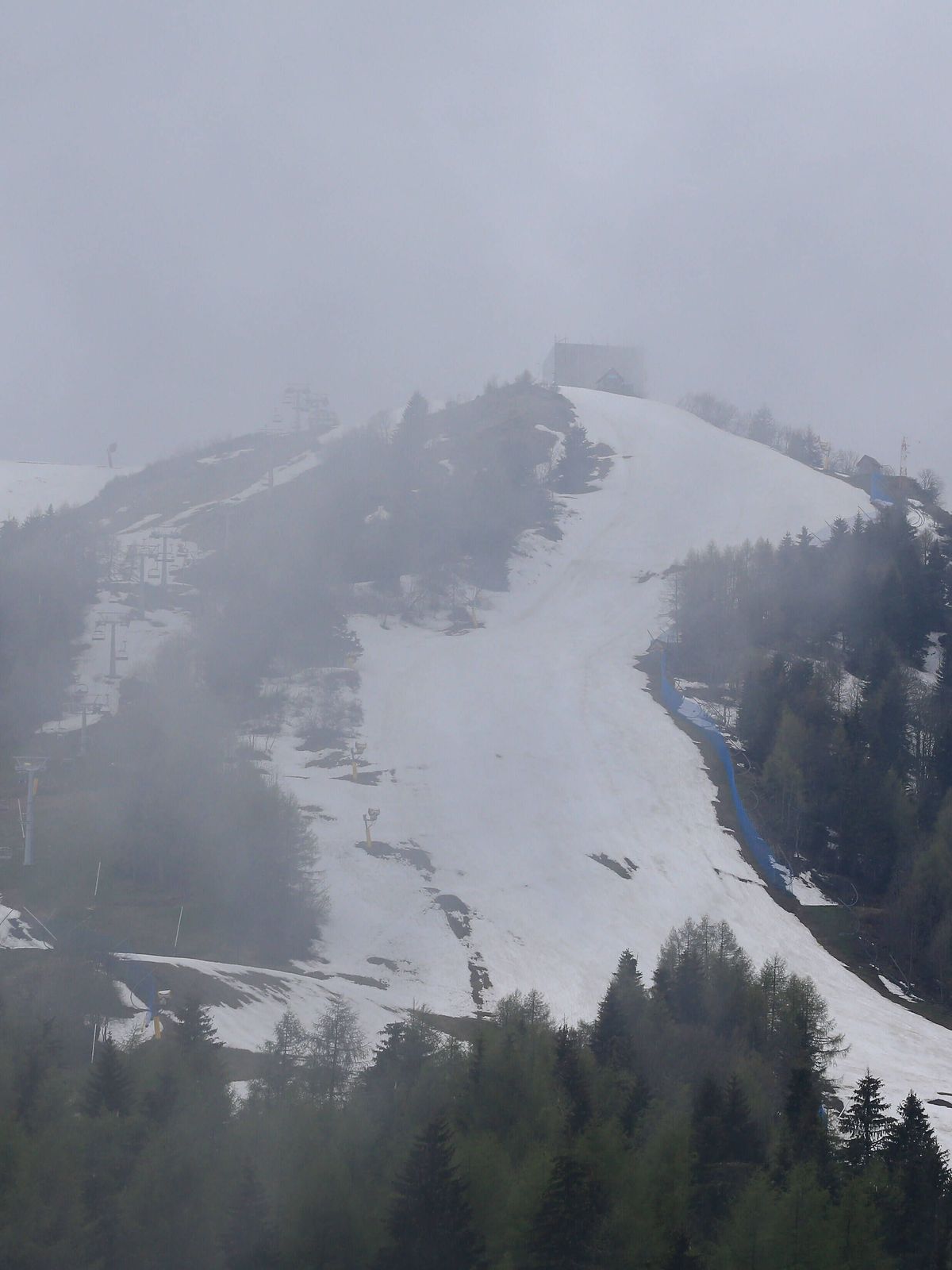 Giro d Italia - Cycling Tour of Italy 2021 under Covid-19 Pandemic. Stage 14 Cittadella Monte Zoncolan. In action on 22 05 2021 in Sutrio, Italy. .The snow on the ski slopes at Monte Zoncolan ( Pie...