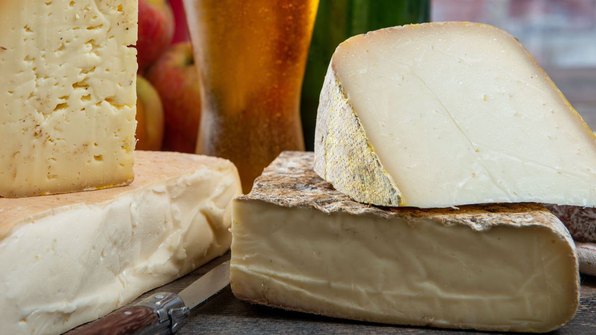 cheeses and Tomme de Savoie with beer, French cheese Savoy, french Alps France.