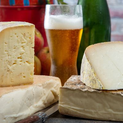 cheeses and Tomme de Savoie with beer, French cheese Savoy, french Alps France.